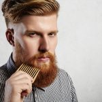 Portrait Of Young Attractive Redhead Hipster Male With Serious A