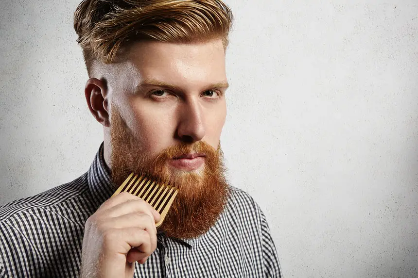 Portrait Of Young Attractive Redhead Hipster Male With Serious A