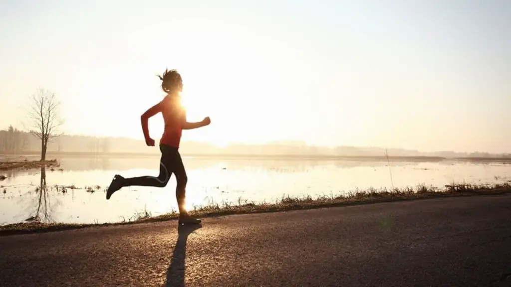 running beside a lake